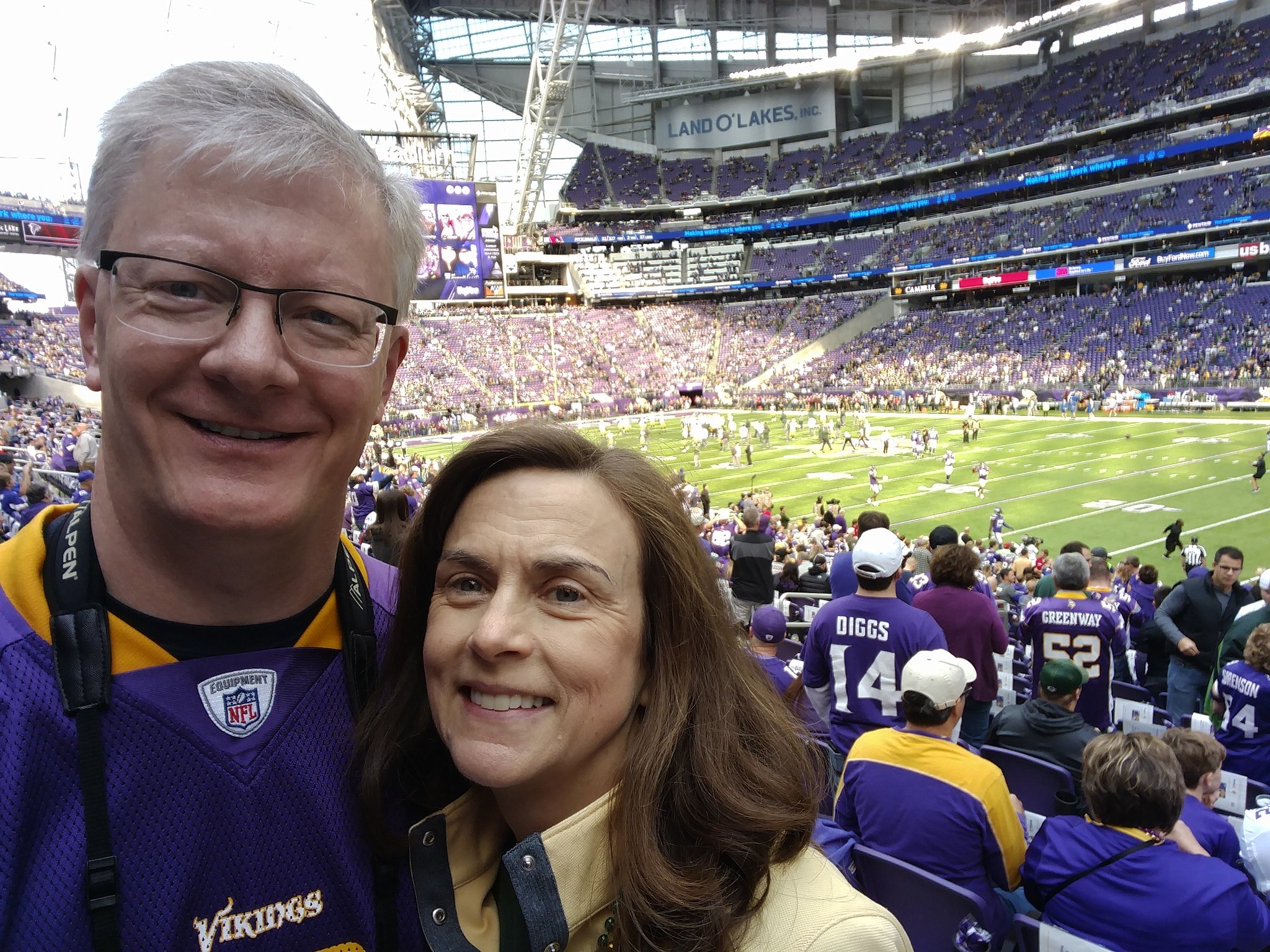 Kevin and his wife at a football game